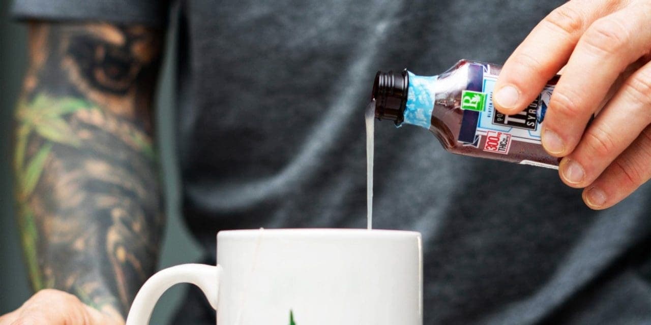 man pouring THC syrup in his white mug