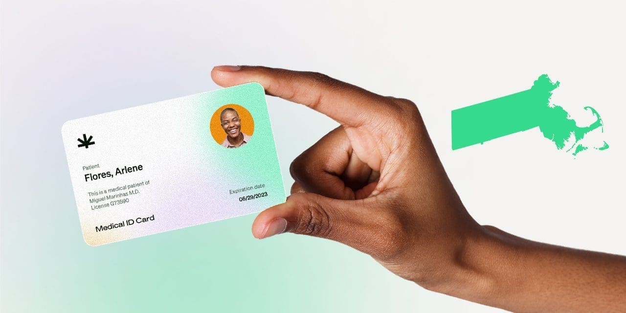 closeup hand holding MMJ card