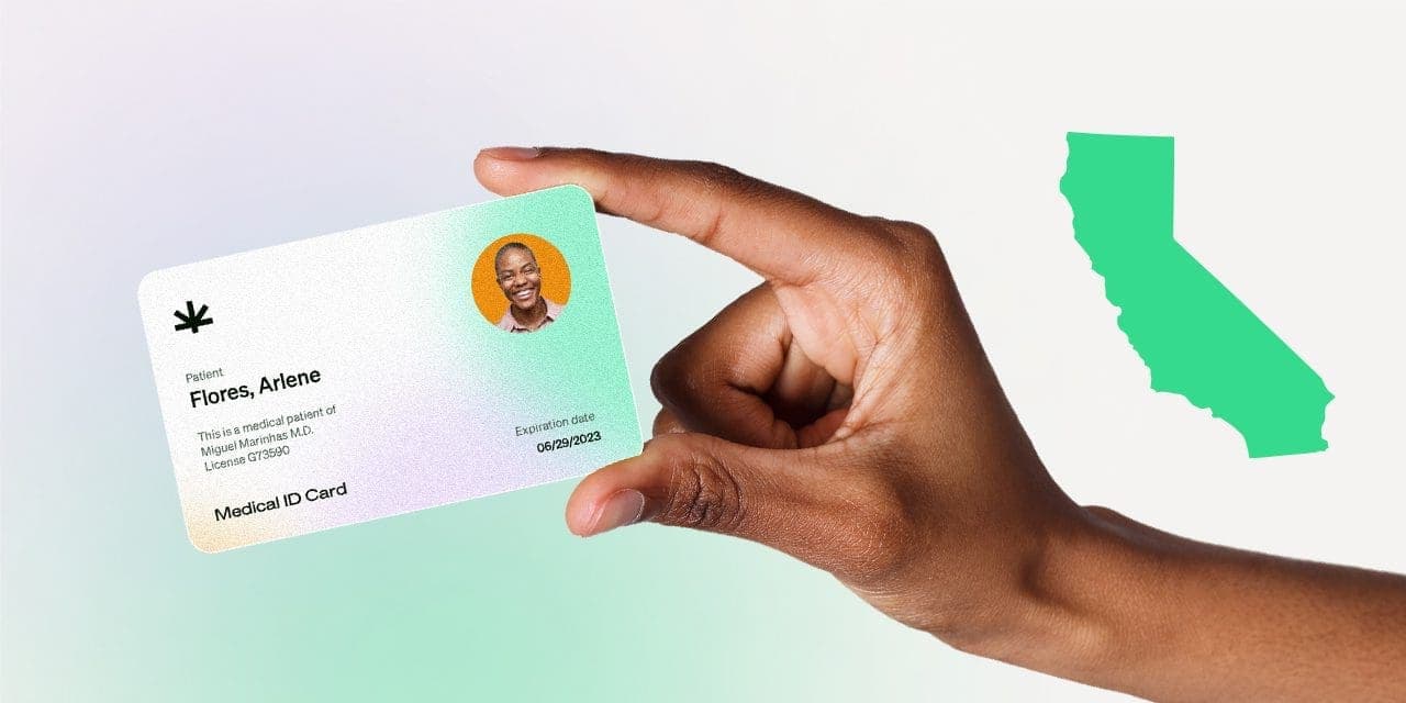 closeup hand holding MMJ card